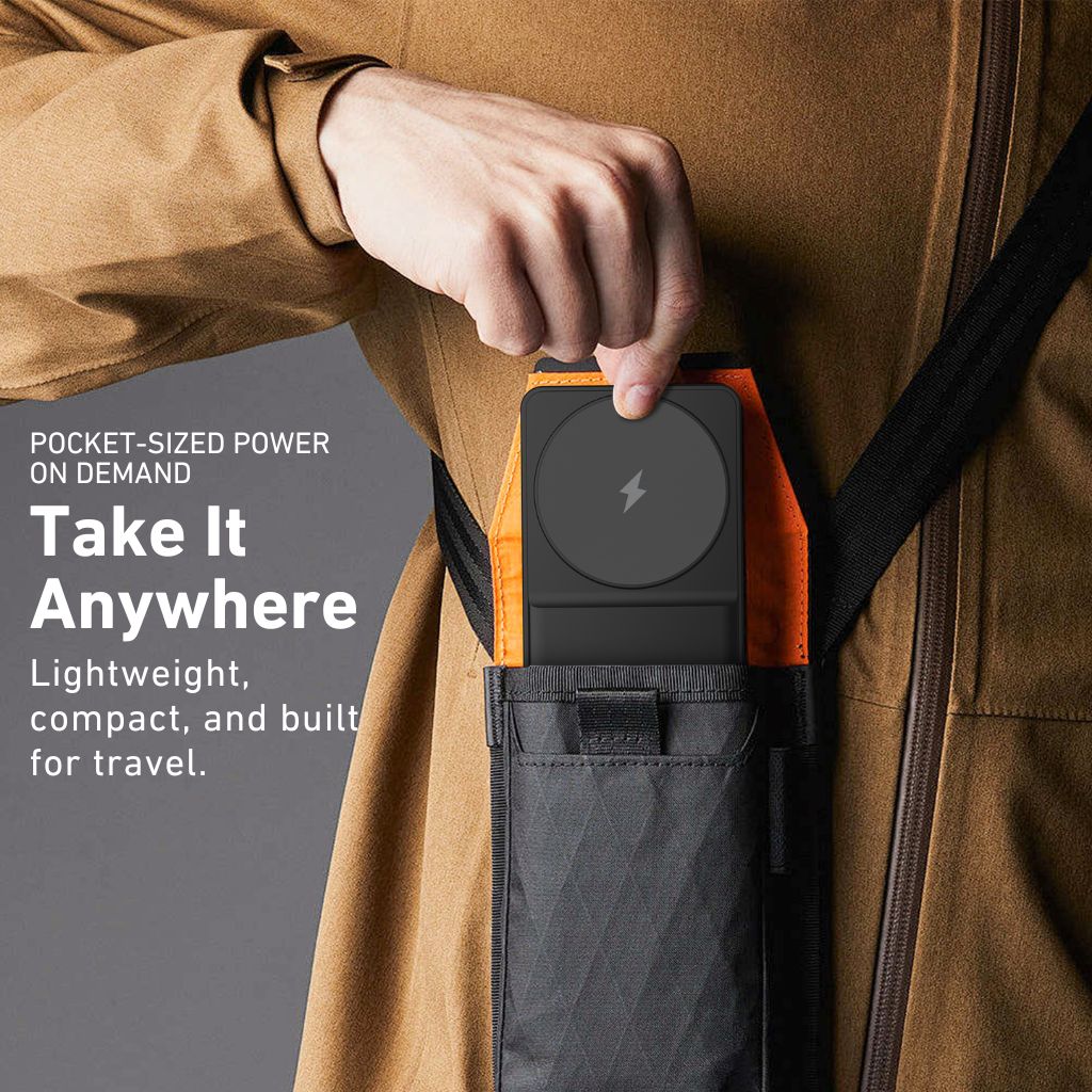 Person holding a pocket-sized power bank with text about its portability and features.