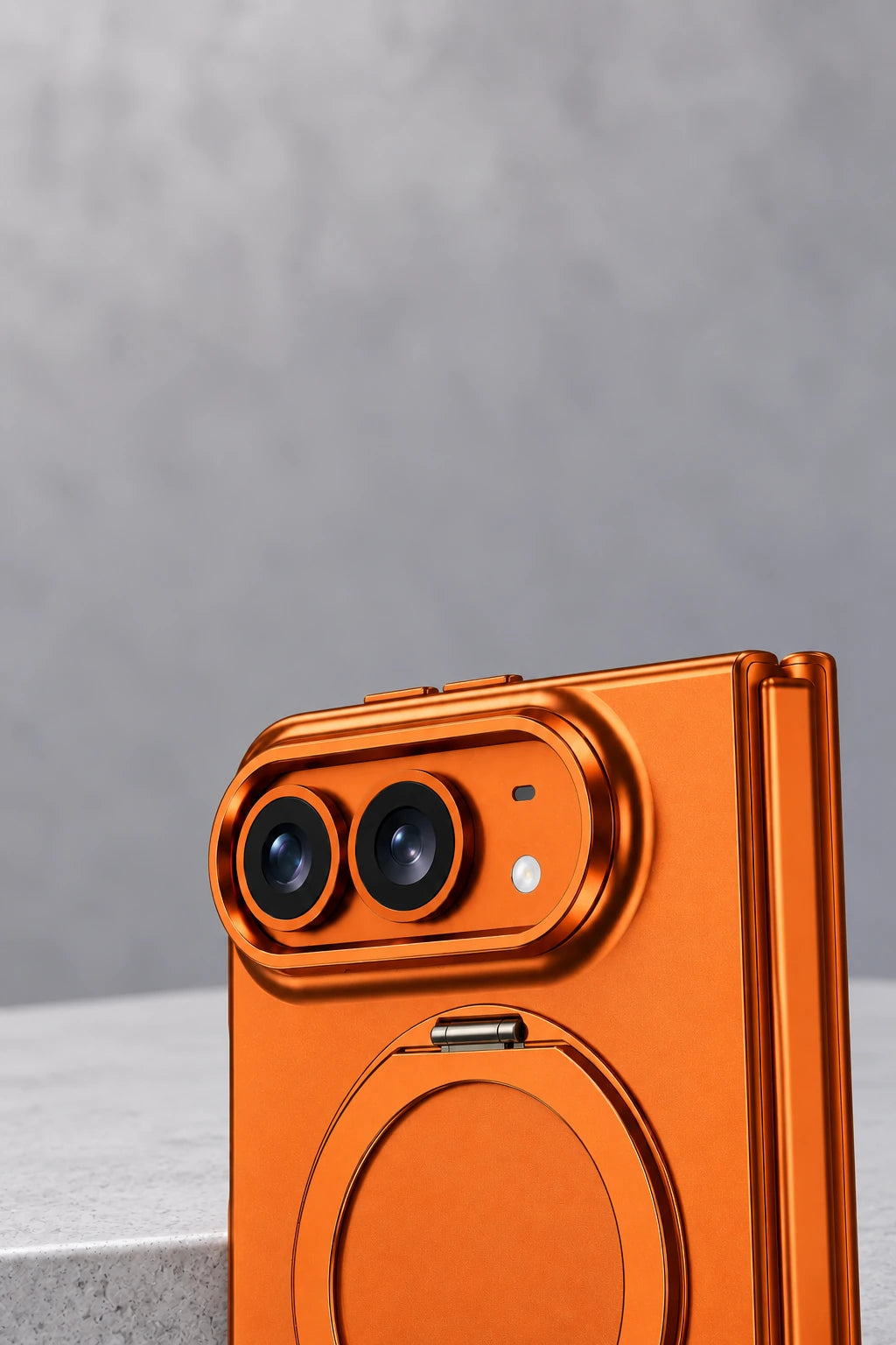 Raised orange oval camera surround around two rear phone lenses.